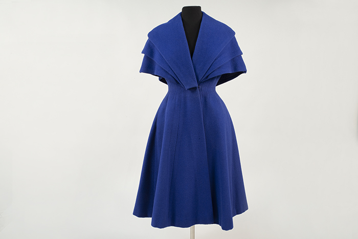 Image of Blue wool coat made in England and sold by John Doyle Bishop, 1951